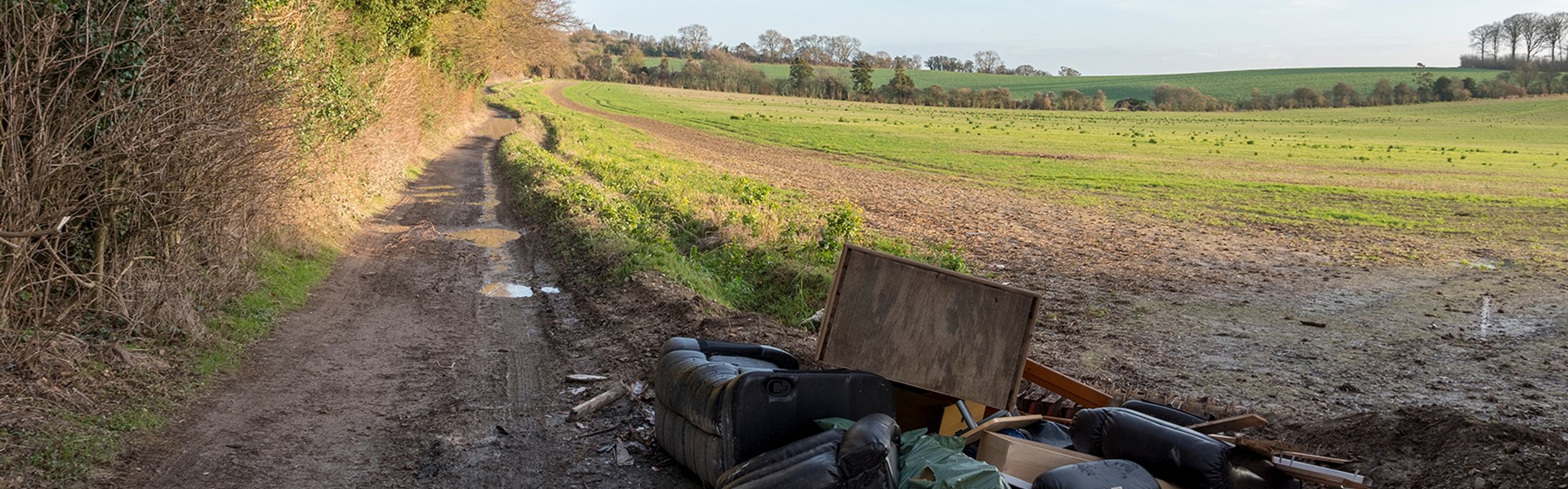 Fly tipping next to field