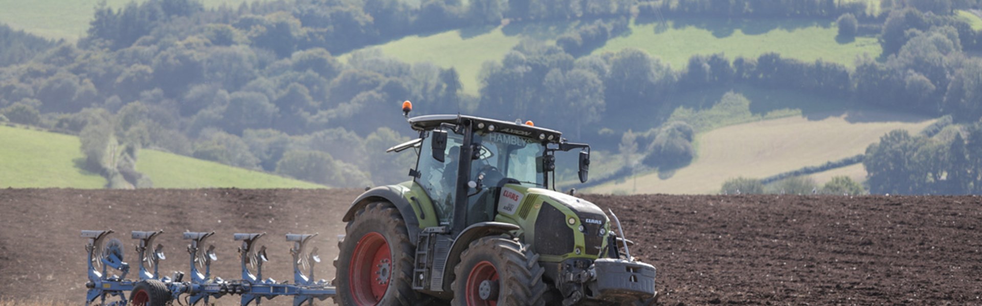 Tractor in field ploughing