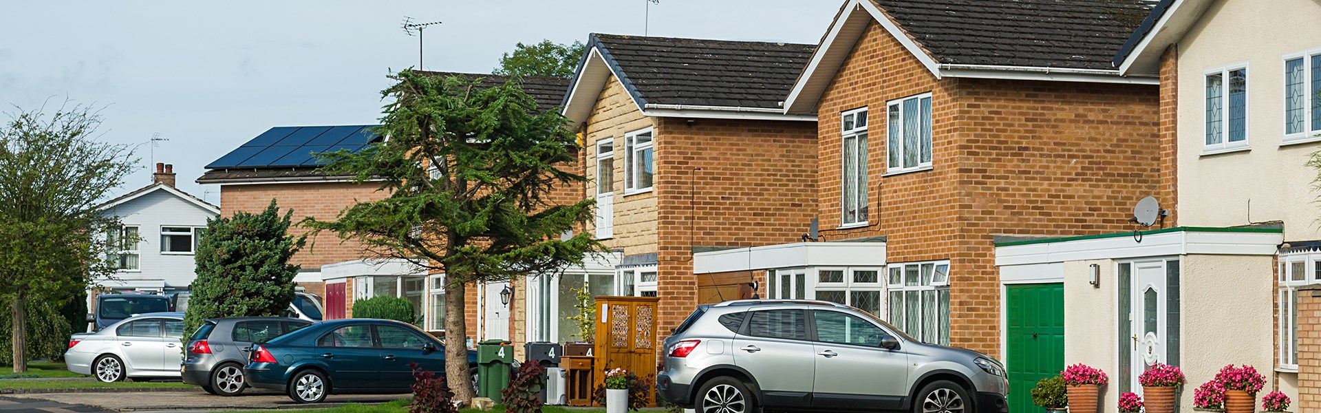 Home With Car In A Driveway