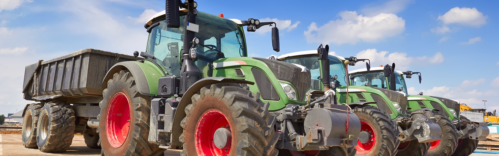 Row Of Green and Red Tractors