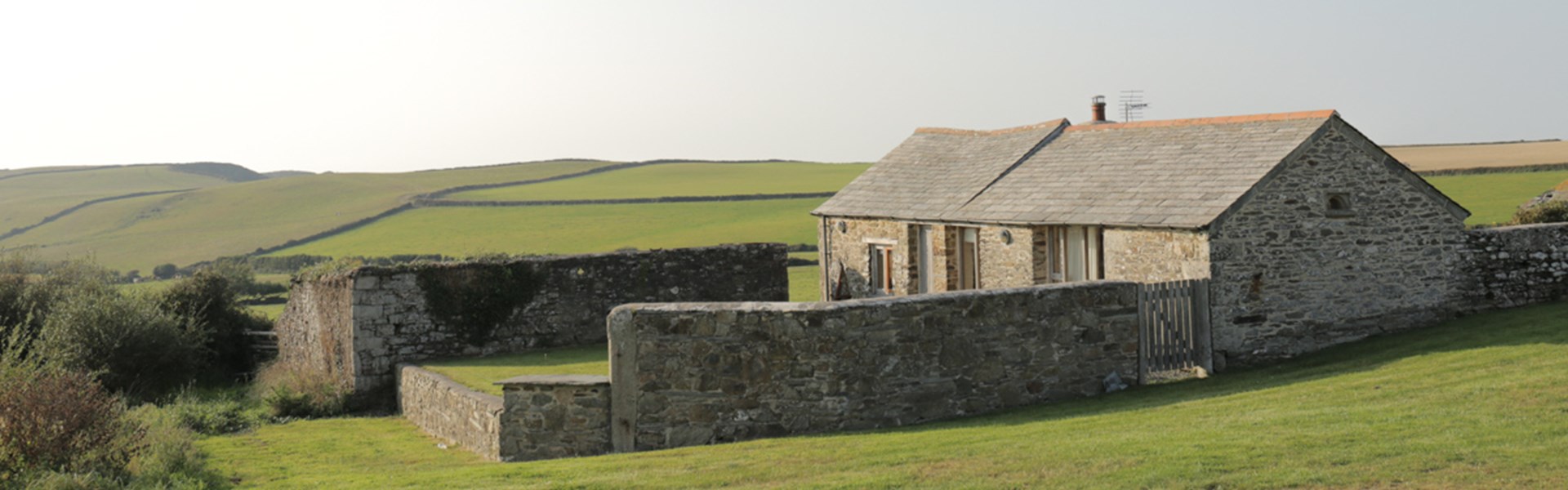 Rural cottage with field backdrop