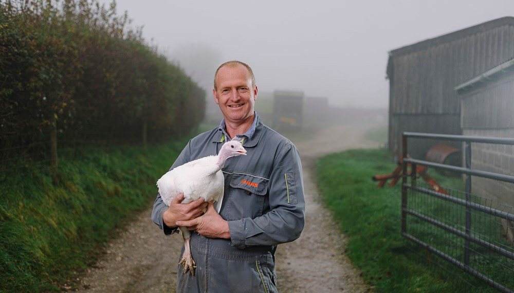 Michael Hine Standing Holding a Turkey