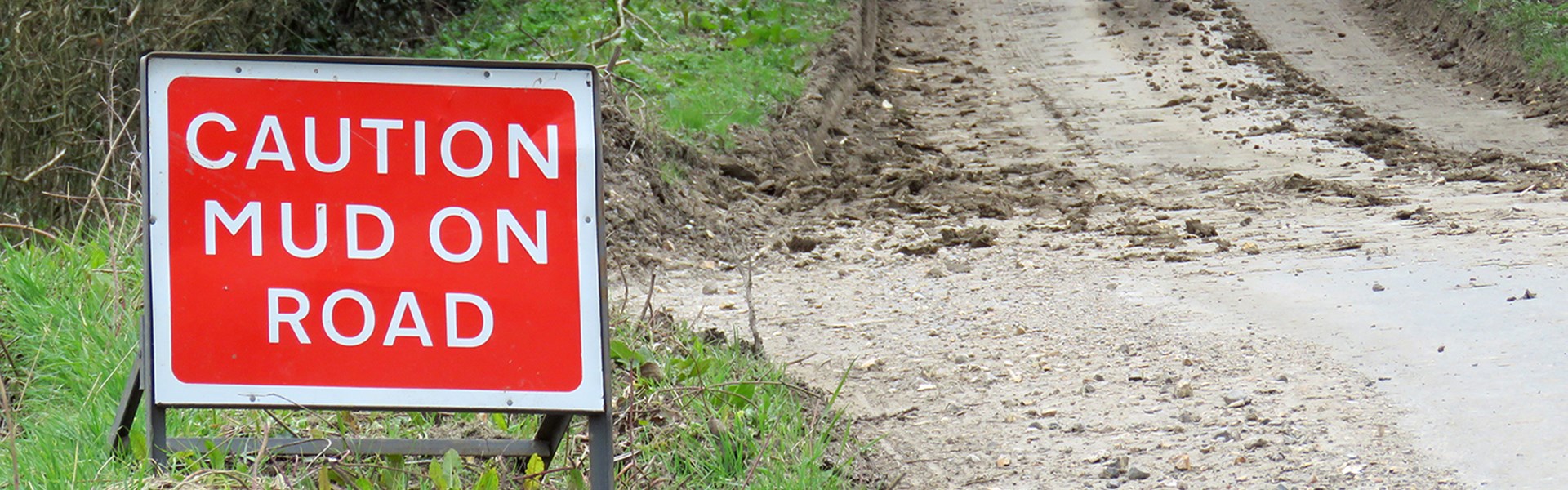 Caution Mud on road sign