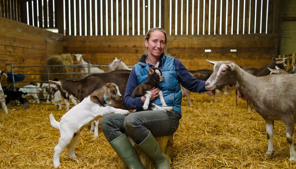 Sara Davies Wookey Farm Somerset sat with three goats